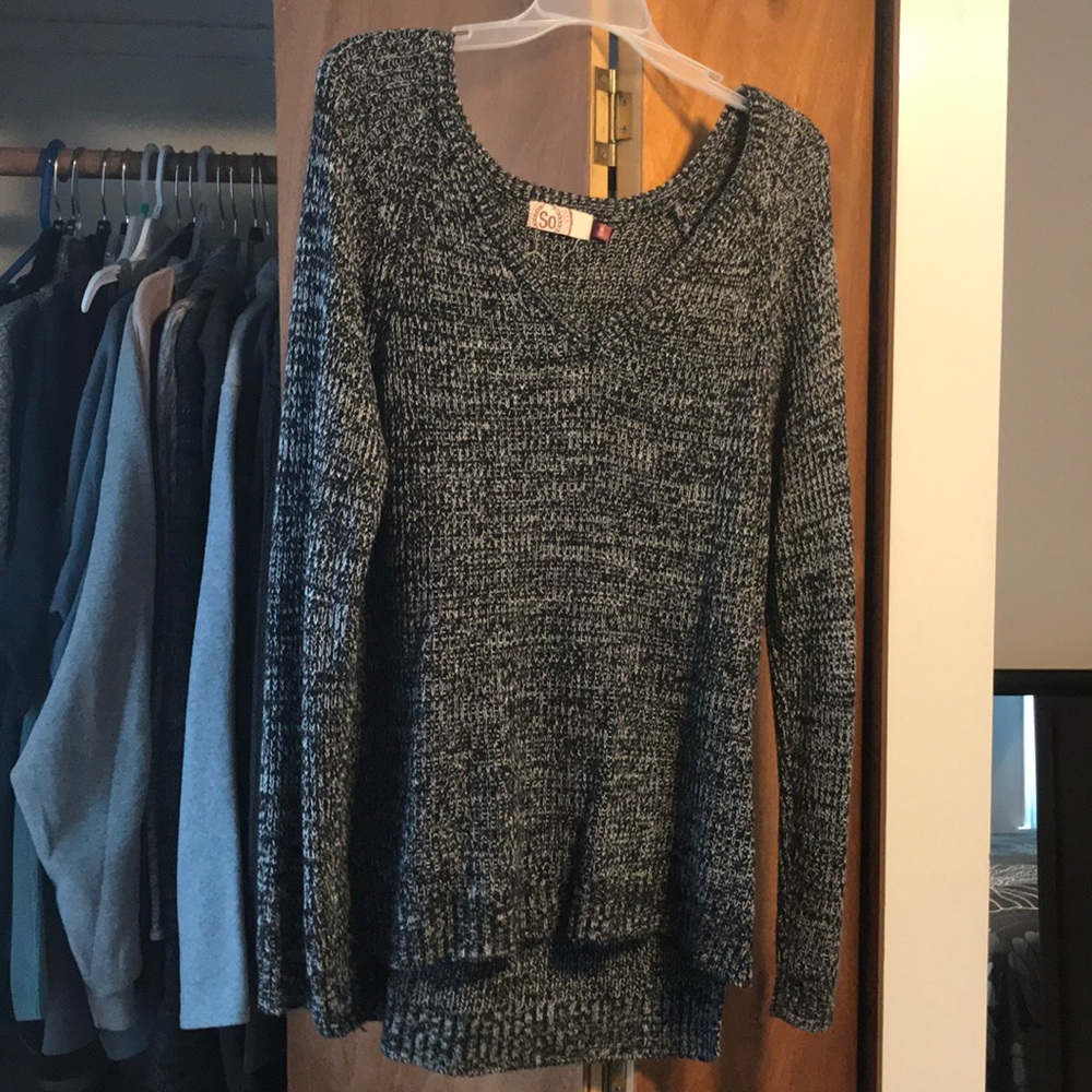 A gray and black sweater from the brand SO